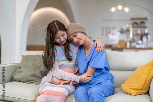 Cancer patient receiving emotional support and care from loved family during chemotherapy recovery, family support, caregiver encouragement, mental health awareness, chronic illness, health insurance