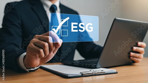Businessman interacting with ESG concept on a digital screen.