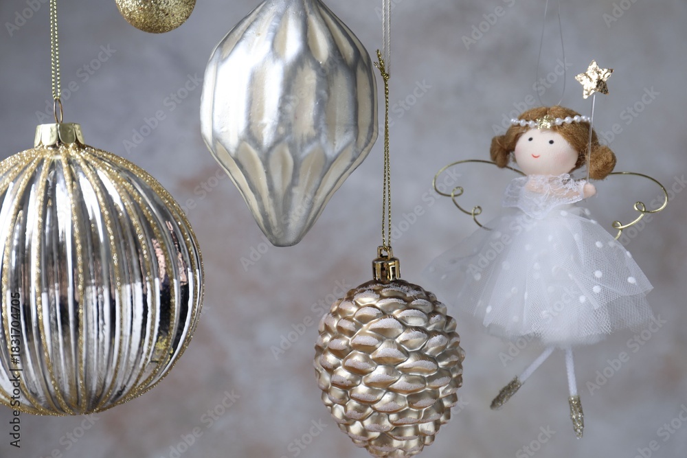 Fototapeta premium Beautiful Christmas decor hanging near light grey wall, closeup