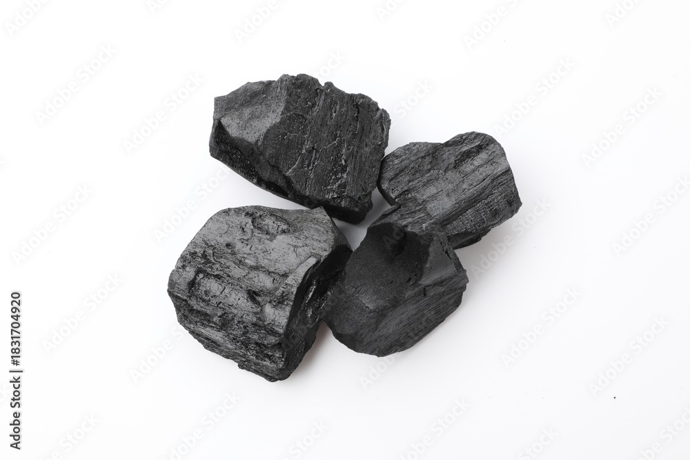 Obraz premium Pieces of black coal isolated on white, top view