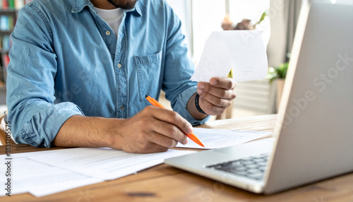 Tax season finance business money accounting budget economy financial planning document review at desk with laptop and pen emotional focus