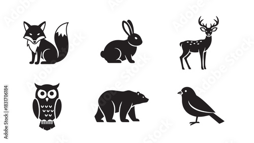 Collection of forest animal silhouettes including fox rabbit deer owl bear and bird isolated on white background