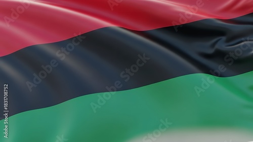The flag of the Black Liberation Movement or Afro-American solidarity movement waving in the wind.