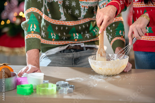 couple lover enjoy Christmas make food and cooking make dessert flour and dough. husband and wife family celebrate party chef dinner on Christmas at home kitchen party with cooking Christmas food