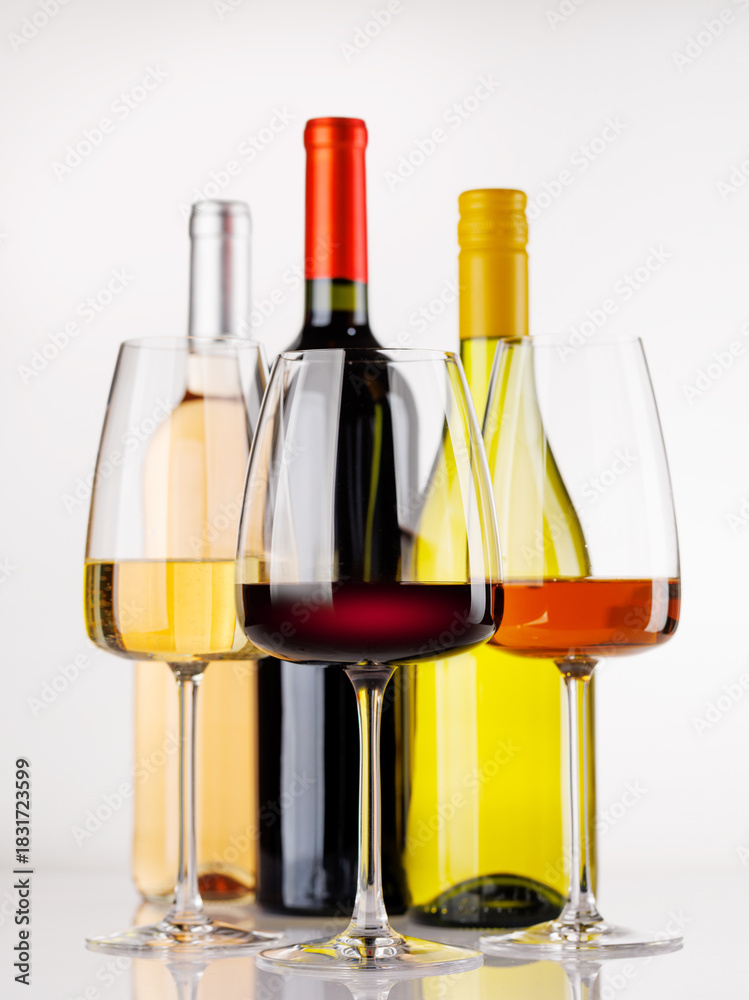 Fototapeta premium Different wine bottles and glasses on white background