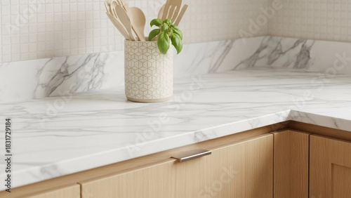 Close-up of Clean White Marble Kitchen Countertop and Wooden Cabinets