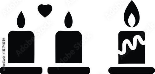 Three lit candles with a heart symbol between two of them