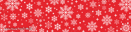 Festive seamless red and white Christmas pattern with decorative snowflakes, falling snow and stars, holiday winter background for greeting cards, wrapping paper and seasonal designs