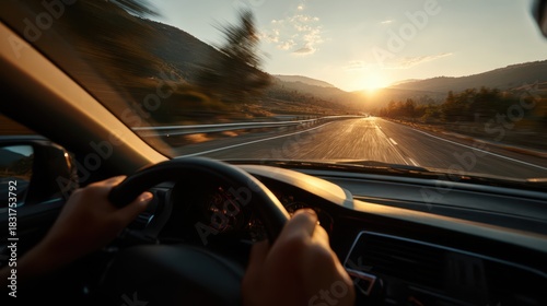 Hands on the steering wheel during a highway road trip: front-seat perspective