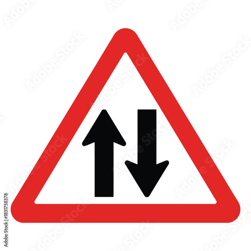 Warning road sign indicating two way traffic ahead, featuring black opposing arrows inside a red triangular border