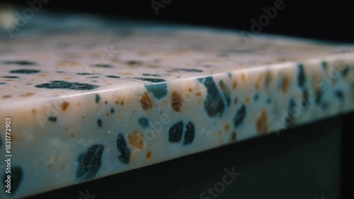 A closeup shot of a speckled countertop edge