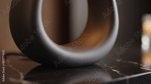 Wallpaper Mural Dark matte toroidal object on a polished black marble surface Torontodigital.ca