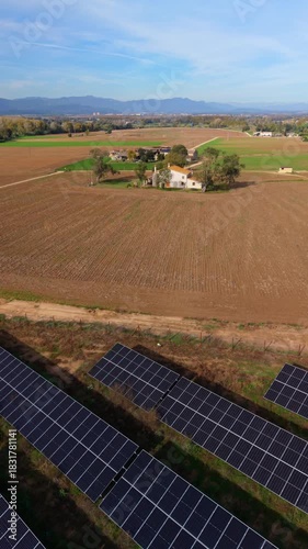 Aerial view of solar panels in rural countryside farm