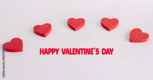 Red hearts with Happy Valentine’s Day message celebrating romantic love holiday decoration concept