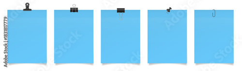 Set of large paper notes with binder clips, bulldog clip, paper clip and push pin. Light blue sheets of paper. Black holders	