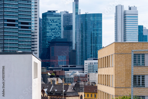 Corporate architecture highlighting a modern skyscraper within the finance district of Frankfurt, emphasizing stability, growth and future skyline presence