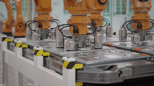 Wallpaper Mural Fully automated EV production line with robotic arms assembling battery modules for the automotive industry. Modern autonomous car factory. Close up. Looping 3d animation render Torontodigital.ca