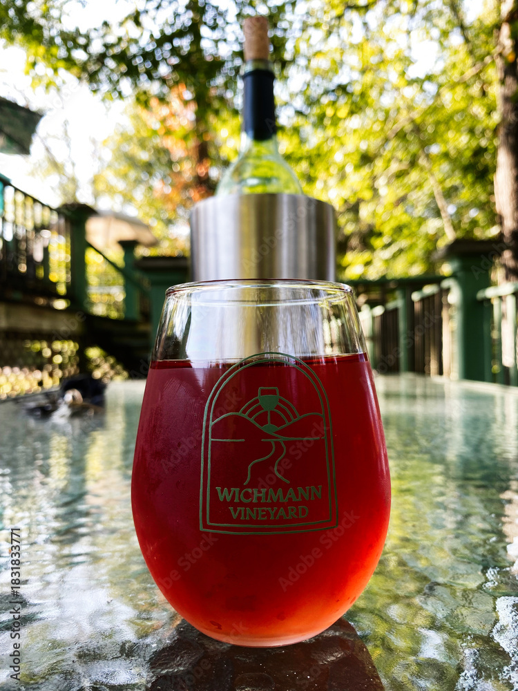 Naklejka premium Red wine in a glass at Wichmann Vineyard outdoor setting in Southern Illinois USA