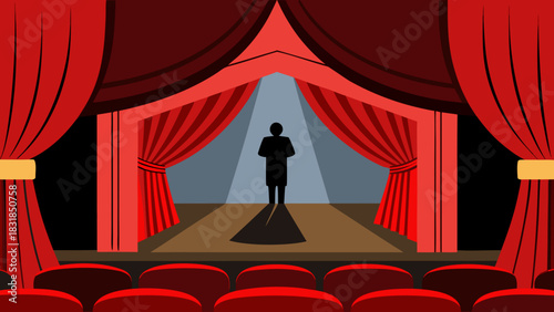 Silhouette of a person standing on a stage under a spotlight with red curtains and empty seats