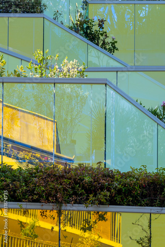 A refined architectural scene where geometry and minimalism guide the facade and contrast with sunlight shaping lines that define modern housing supported by clean design and unified urban style