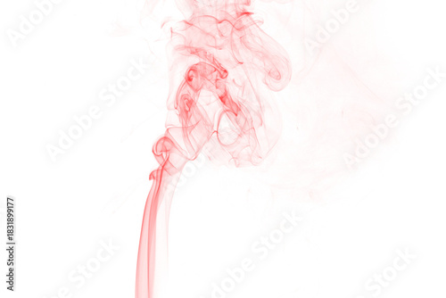 Abstract crimson smoke wisps ascend against a stark black background creating an ethereal and dramatic visual effect