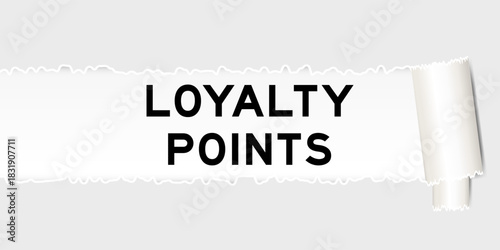 Ripped gray paper background that have word loyalty points under torn part