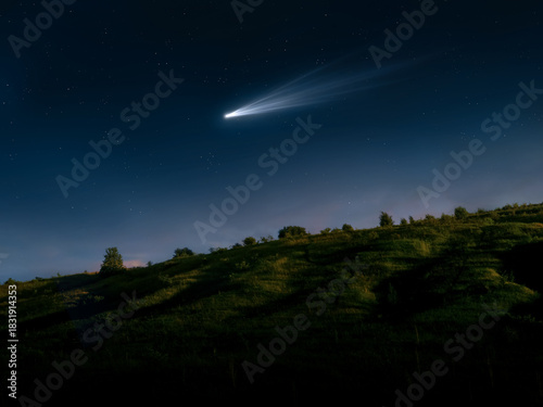 Comet in the sky visible to the naked eye. Bright tail of a comet over a hill. Astronomical observation of a space object.