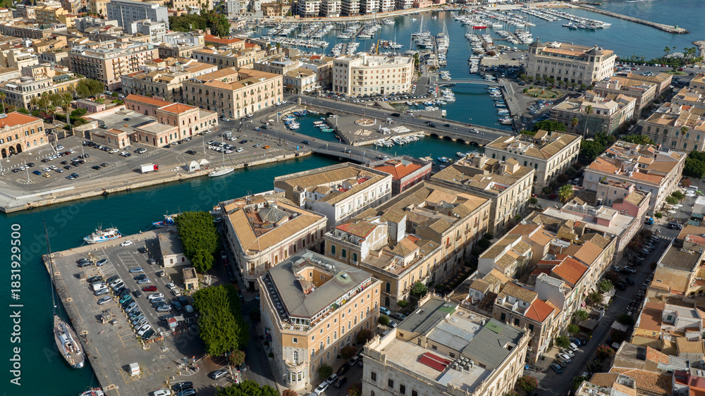 Fototapeta premium Aerial view of the access bridges to the island of Ortygia. These roads lead to the historic center of Syracuse, Sicily, Italy. It's a sunny morning.