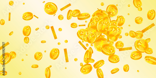 Chinese yuan coins falling. Scattered gold CNY