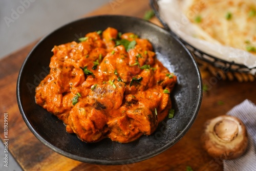 Homemade Mushroom tikka masala served with malabar porotta, selective focus
