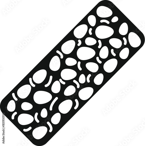 Close up of a rectangular piece of tempeh, a fermented soy product, highlighting its unique texture