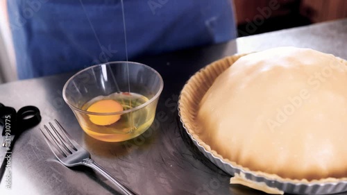 Woman hands breaking egg for raw apple pie at home – Holiday baking, Christmas recipe, family lifestyle concept