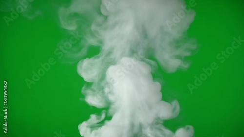 Dynamic white smoke plume rising gracefully on a vibrant green screen backdrop for visual effects and compositing