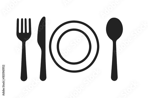 Table setting with fork, knife, spoon, and plate arranged neatly for a dining experience