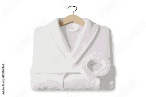 Soft white bathrobe hanging on a wooden hanger in a well-lit room