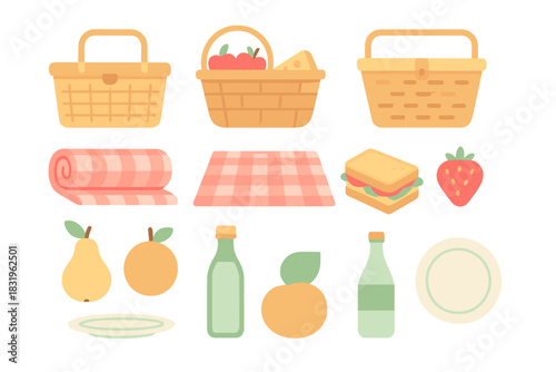 Picnic setup with baskets, a blanket, and fresh fruits and sandwiches in a cozy outdoor scene