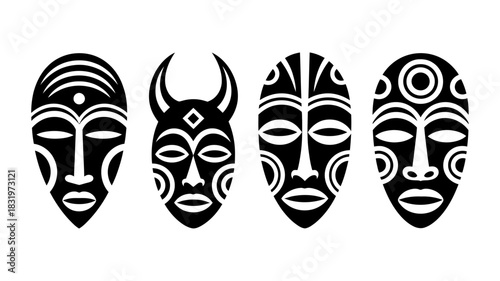 Four diverse african tribal masks, intricately designed with bold black and white patterns, symbolizing culture and tradition, isolated on white