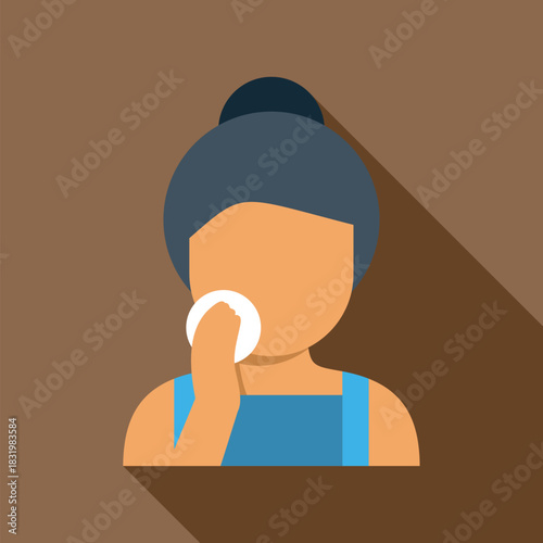Woman performing skincare routine by cleaning face with cotton pad