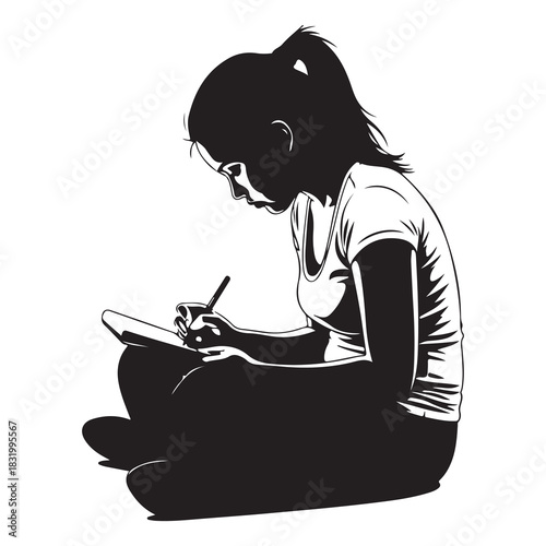 Young girl sitting cross legged on the floor focused on writing or drawing in a notebook with a pen