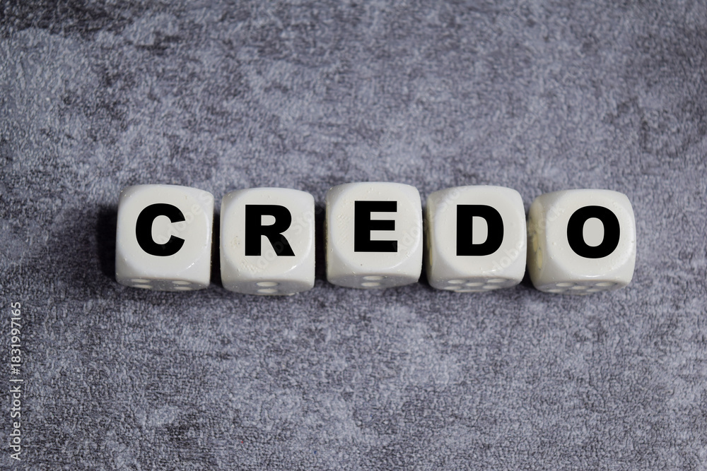 Obraz premium Credo text stacked wooden cubes on the table. Symbolizing core values and beliefs