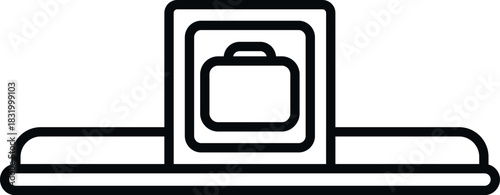 Luggage passing through an x ray scanner on a conveyor belt for airport security