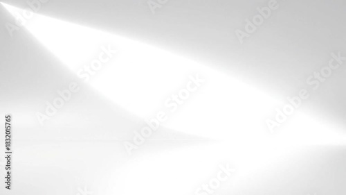 A minimalist white background with a bright spotlight shining from the upper left corner area