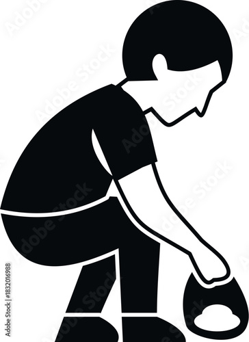 Child crouching, picking up trash into a bag, promoting cleaning