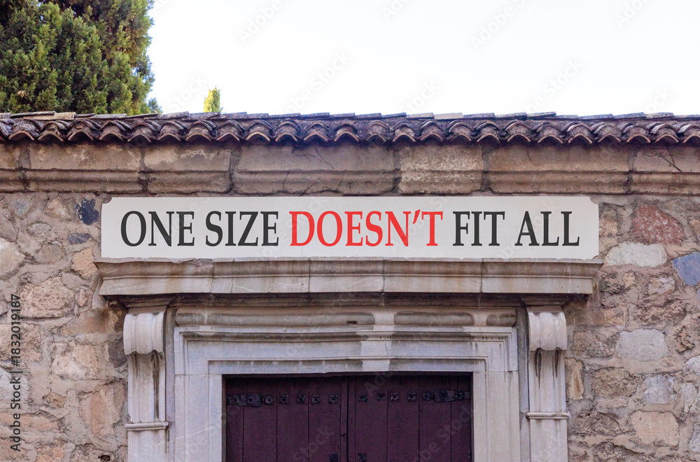 Fototapeta premium One size does not fit all symbol. Concept words One size does not fit all on beautiful white marble sign plate. Beautiful stone wall background. Business one size does not fit all concept. Copy space.