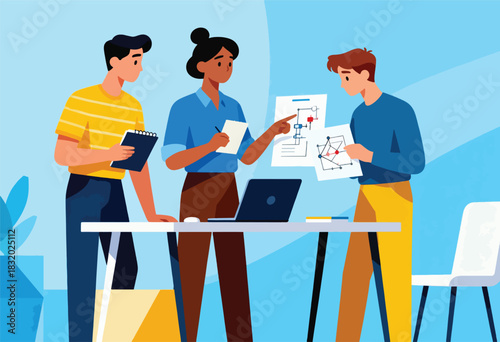 A team of three diverse individuals collaborates, pointing at diagrams on paper with a laptop on a table