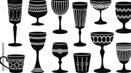 A collection of black and white decorative glasses and a coffee cup