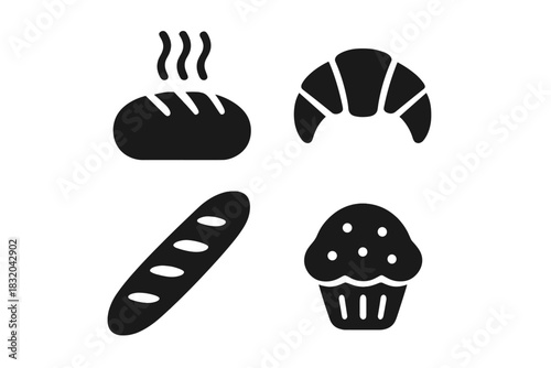 Assortment of baked goods displayed on a table at a bakery during morning hours