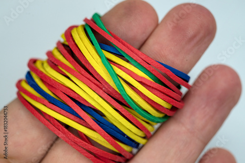 Photo of colored rubber bands on the fingers