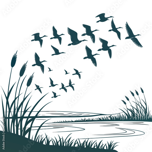 Flock of geese flying in formation over a serene wetland landscape at dawn