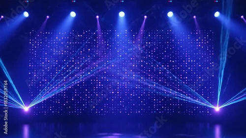 Stage with blue lights and laser beams against a dotted backdrop
